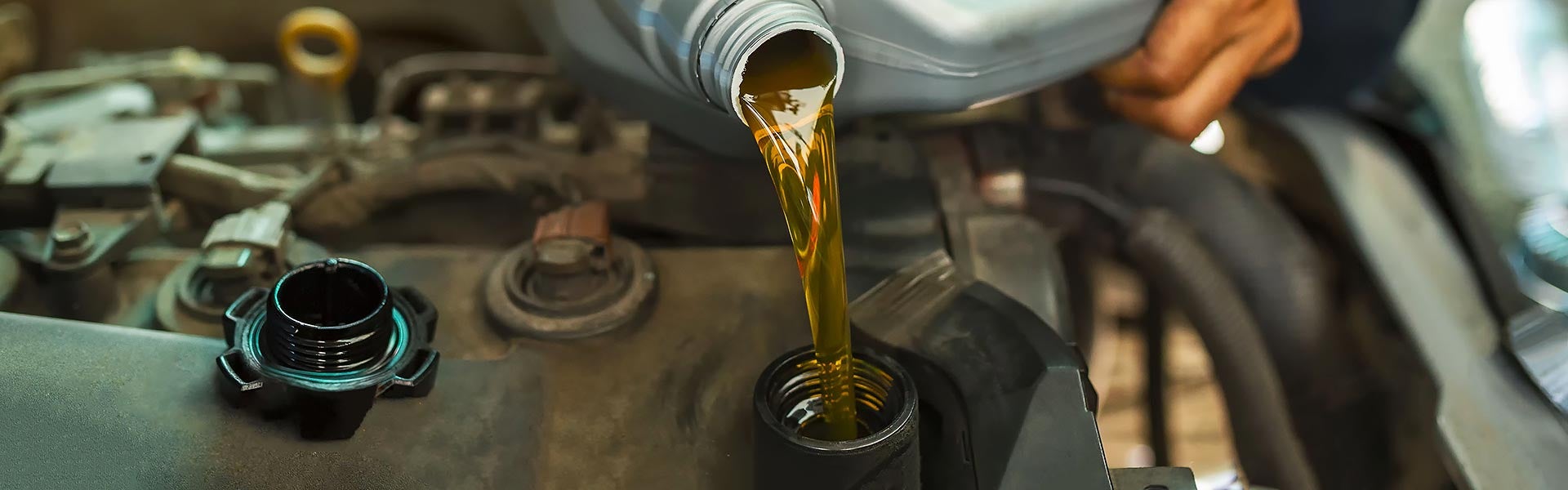 Certified technician performing an oil change on a Buick or GMC vehicle at Cable Dahmer Buick GMC of Kansas City